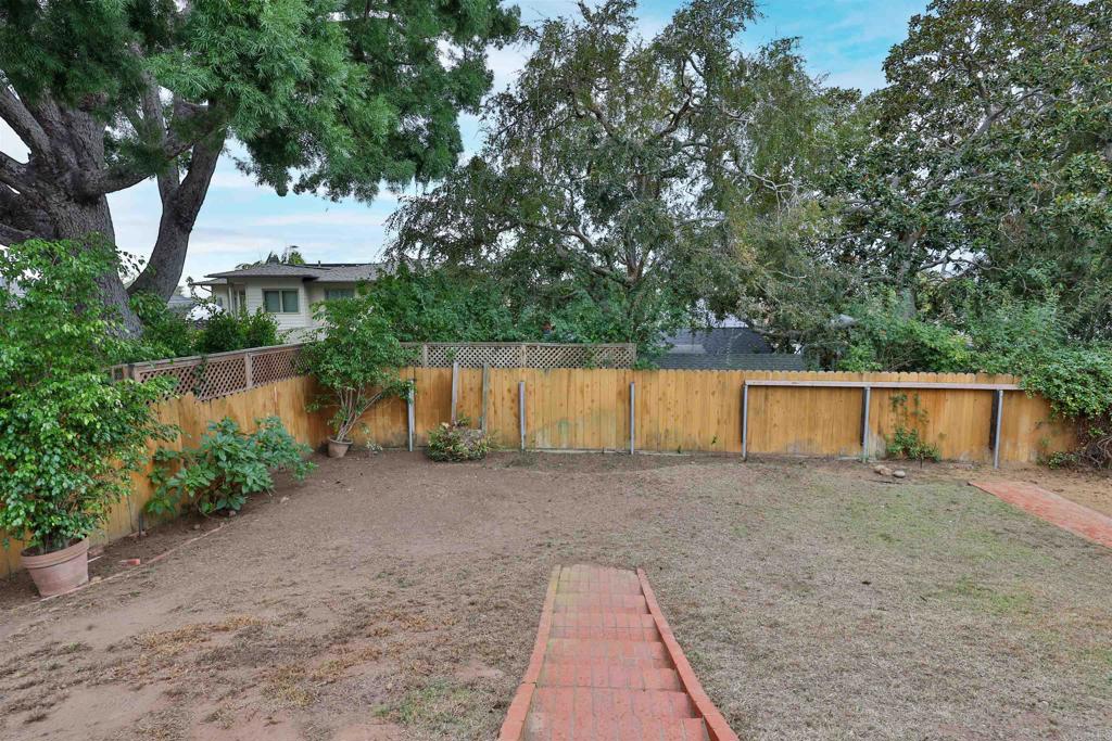 5930 Waverly Avenue La Jolla, CA 92037 - Photo 55 of 61 a backyard of a house with lots of green space