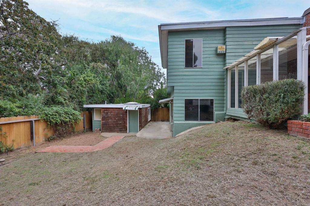 5930 Waverly Avenue La Jolla, CA 92037 - Photo 56 of 61 a front view of a house with yard and trees