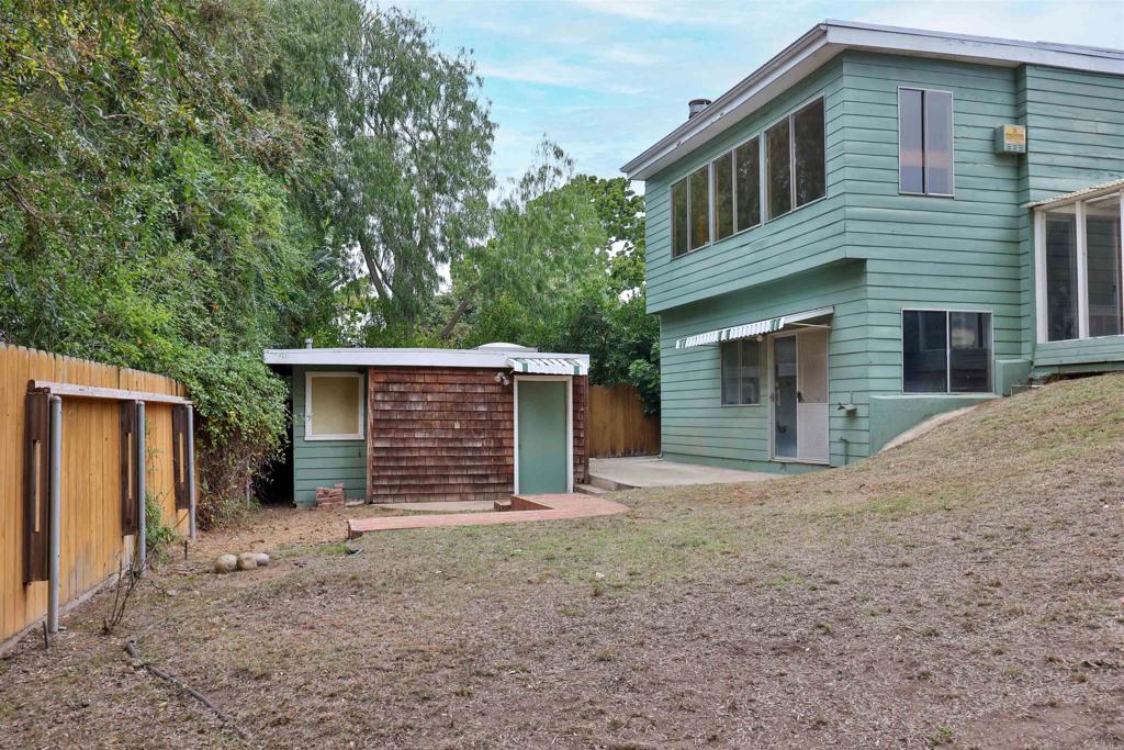 5930 Waverly Avenue La Jolla, CA 92037 - Photo 59 of 61 a front view of a house with a yard and garage