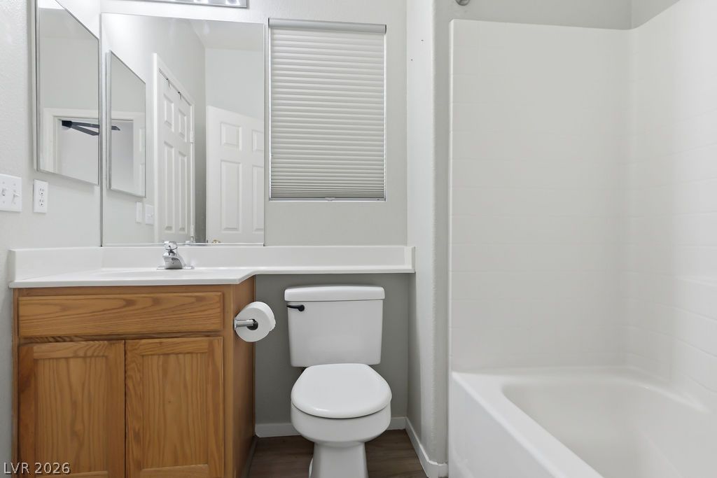 754 Solitude Point Avenue Henderson, NV 89012 - Photo 24 of 38 A well-maintained bathroom featuring a practical vanity and convenient tub.