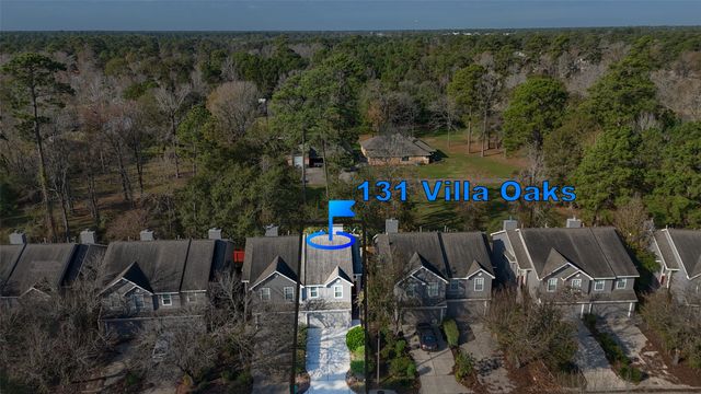 an outdoor space with seating area and trees