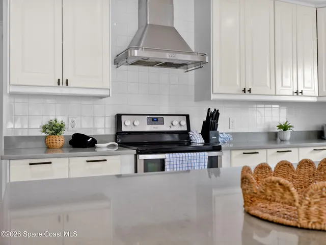 view of a bathroom with a shower and a sink