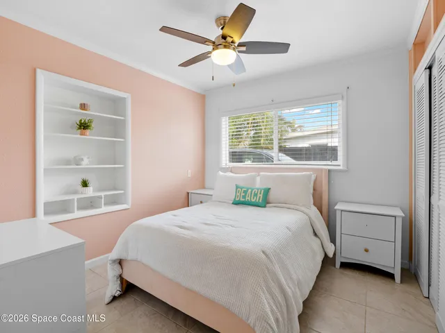 a view of a hallway with wooden floor and glass door
