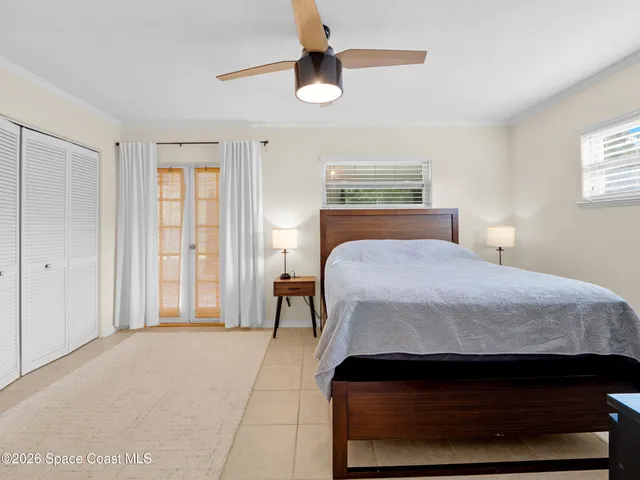 a white toilet sitting next to a bath tub