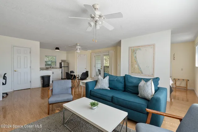 a bathroom with a granite countertop sink mirror and a bathtub