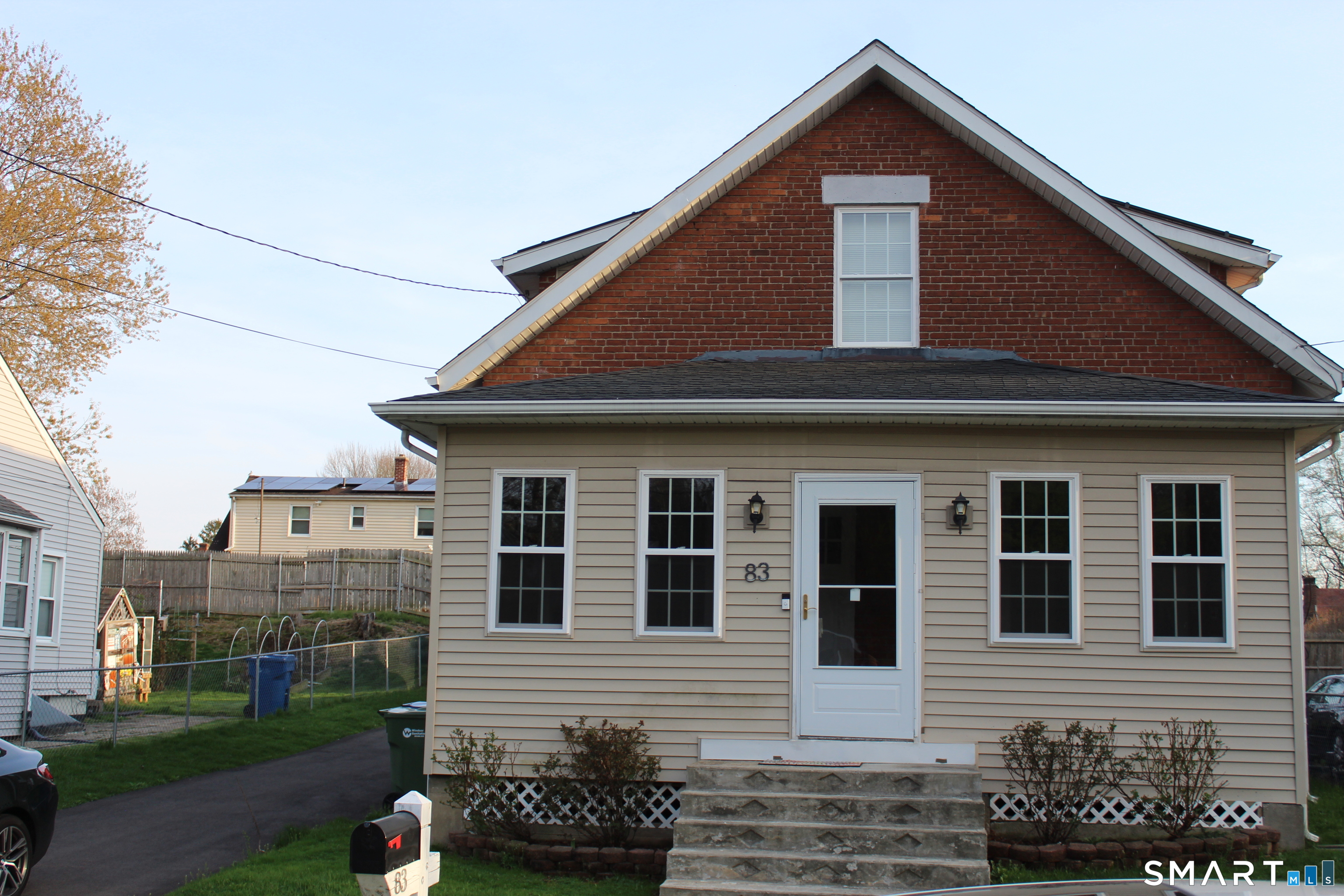 83 Faneuil Street Windsor, CT 06095 - Photo 14 of 14 a front view of a house with a yard