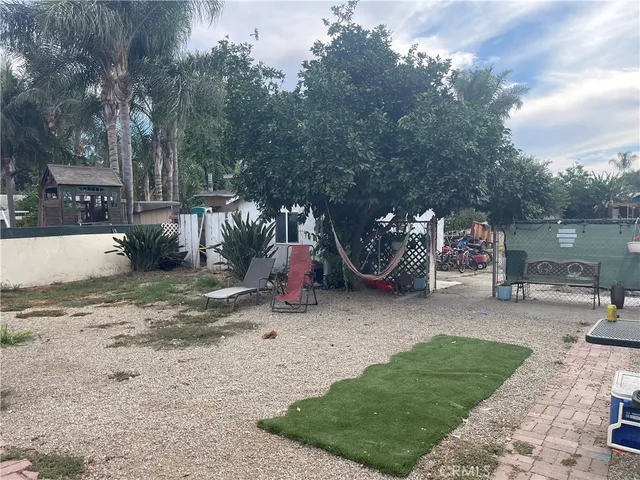 a childrens park with lots of swings and slides