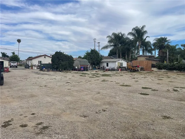 a view of a parking area with cars parked