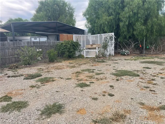 a wooden house with a yard