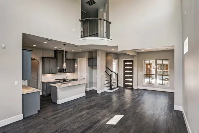 a kitchen with stainless steel appliances granite countertop a stove and cabinets
