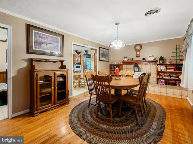 a living room with fireplace furniture and a flat tv screen