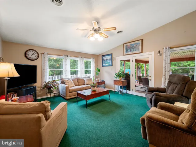 a bedroom with a bed lamp and a potted plant