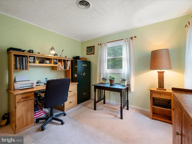 a view of a backyard with sitting area