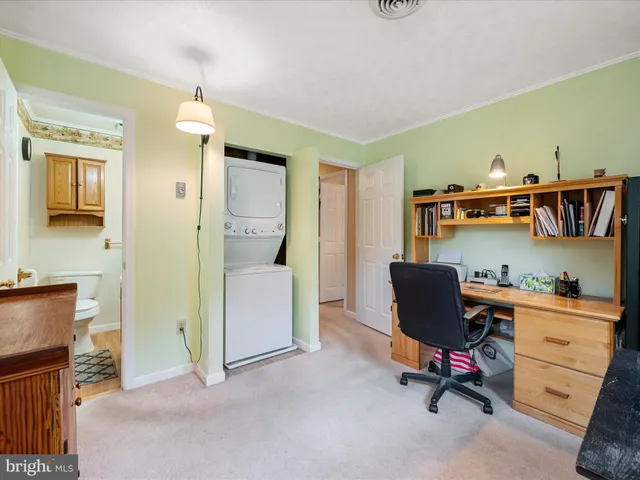 a view of a field with trees in the background