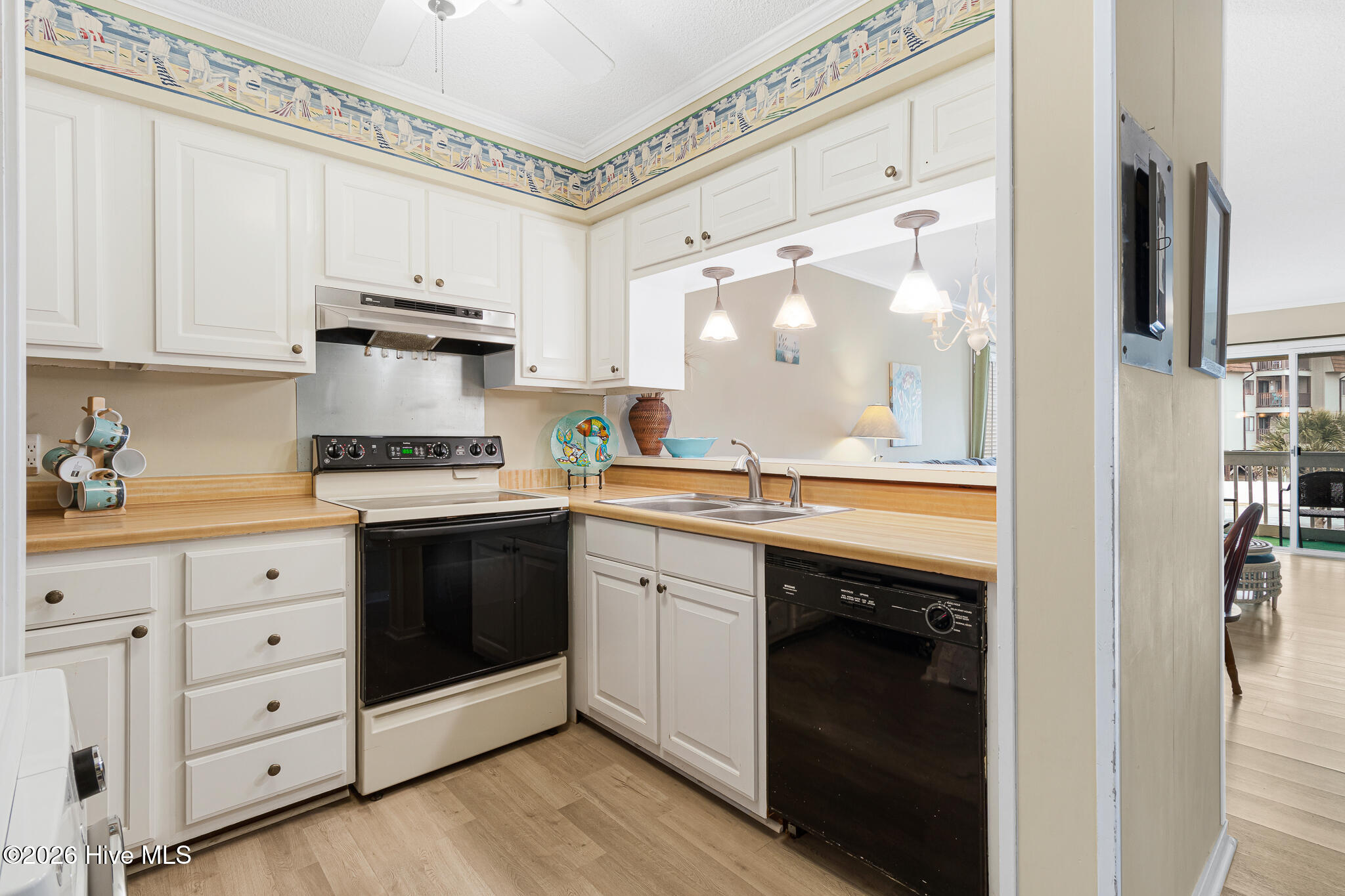 1904 East Fort Macon Road, Unit 156 Atlantic Beach, NC 28512 - Photo 13 of 49 Kitchen overlooking Living Room