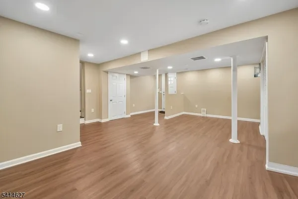 a view of a big room with wooden floor