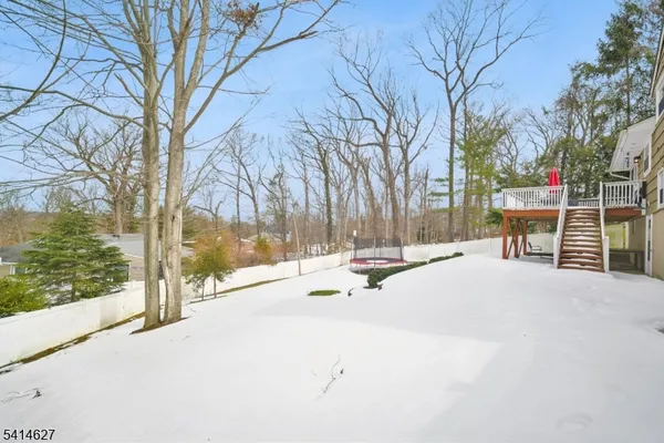 a swimming pool with outdoor seating and yard