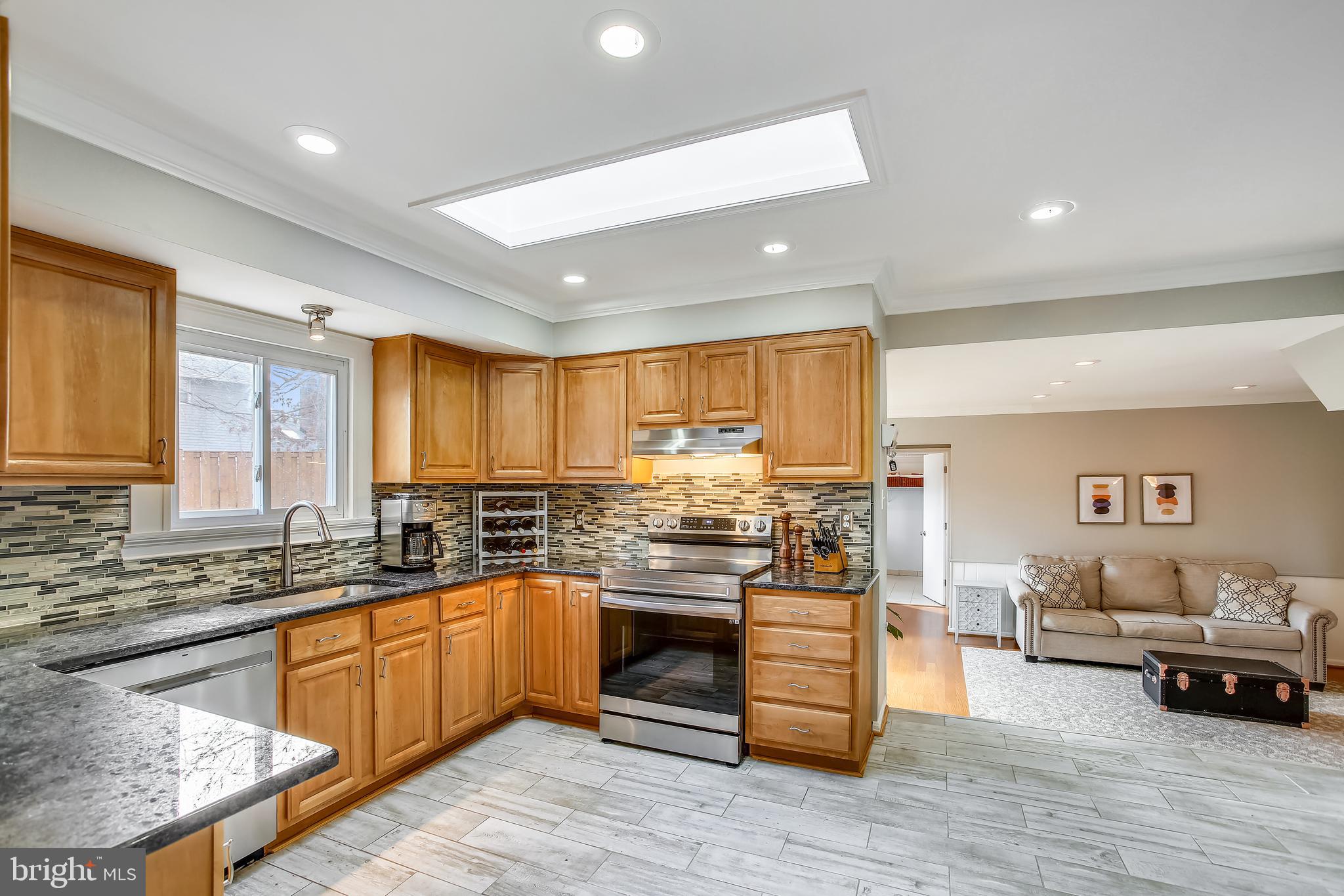 6005 Filbert Court Springfield, VA 22152 - Photo 19 of 55 a kitchen with lots of counter top space and living room