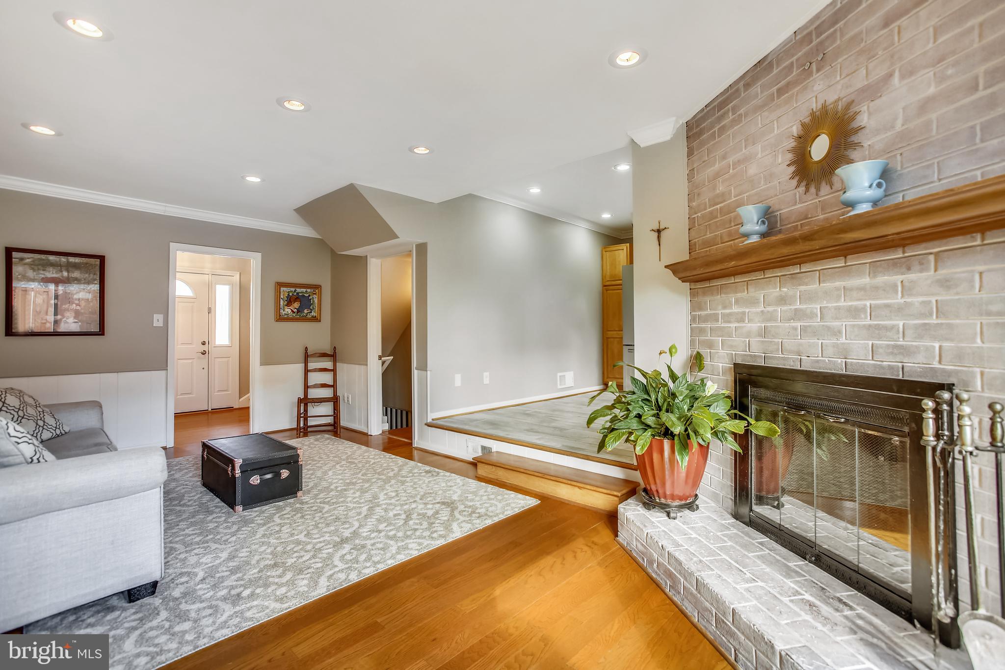 6005 Filbert Court Springfield, VA 22152 - Photo 26 of 55 a living room with furniture and a fireplace