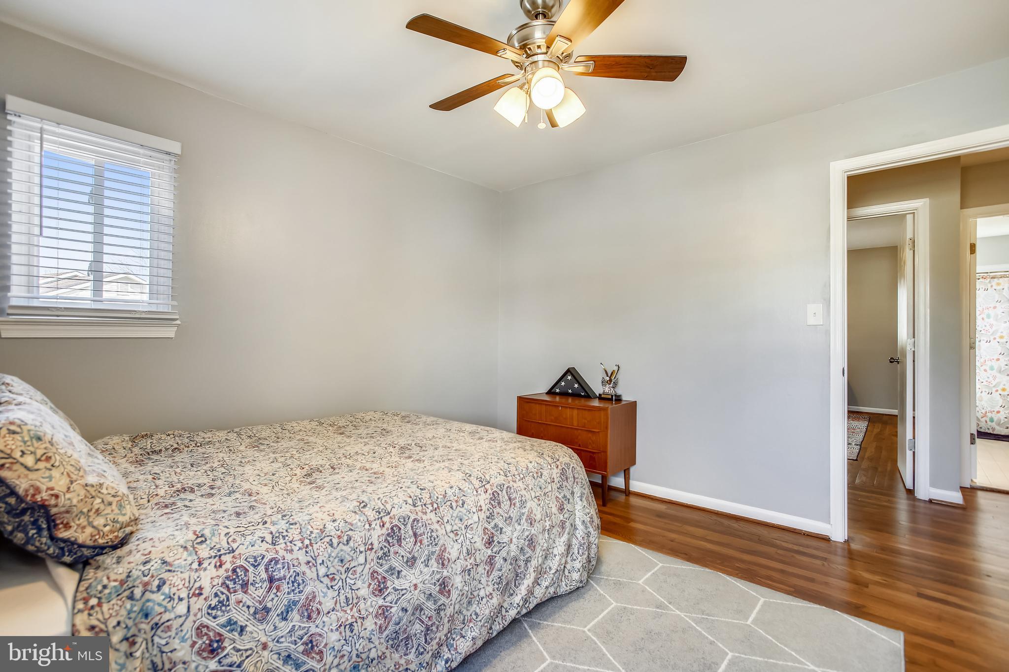6005 Filbert Court Springfield, VA 22152 - Photo 38 of 55 a bedroom with a bed and wooden floor