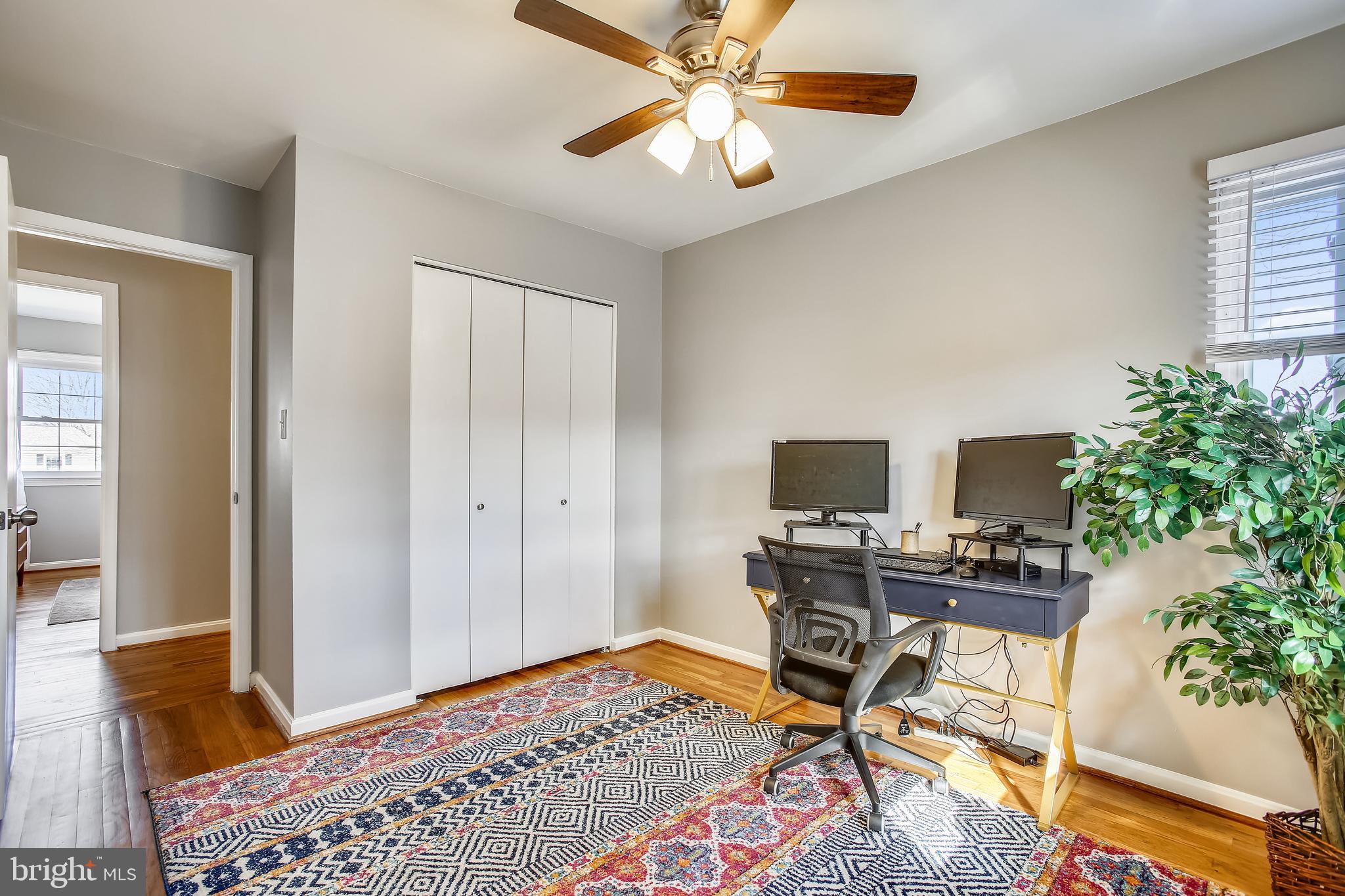 6005 Filbert Court Springfield, VA 22152 - Photo 42 of 55 a workspace with furniture and wooden floor