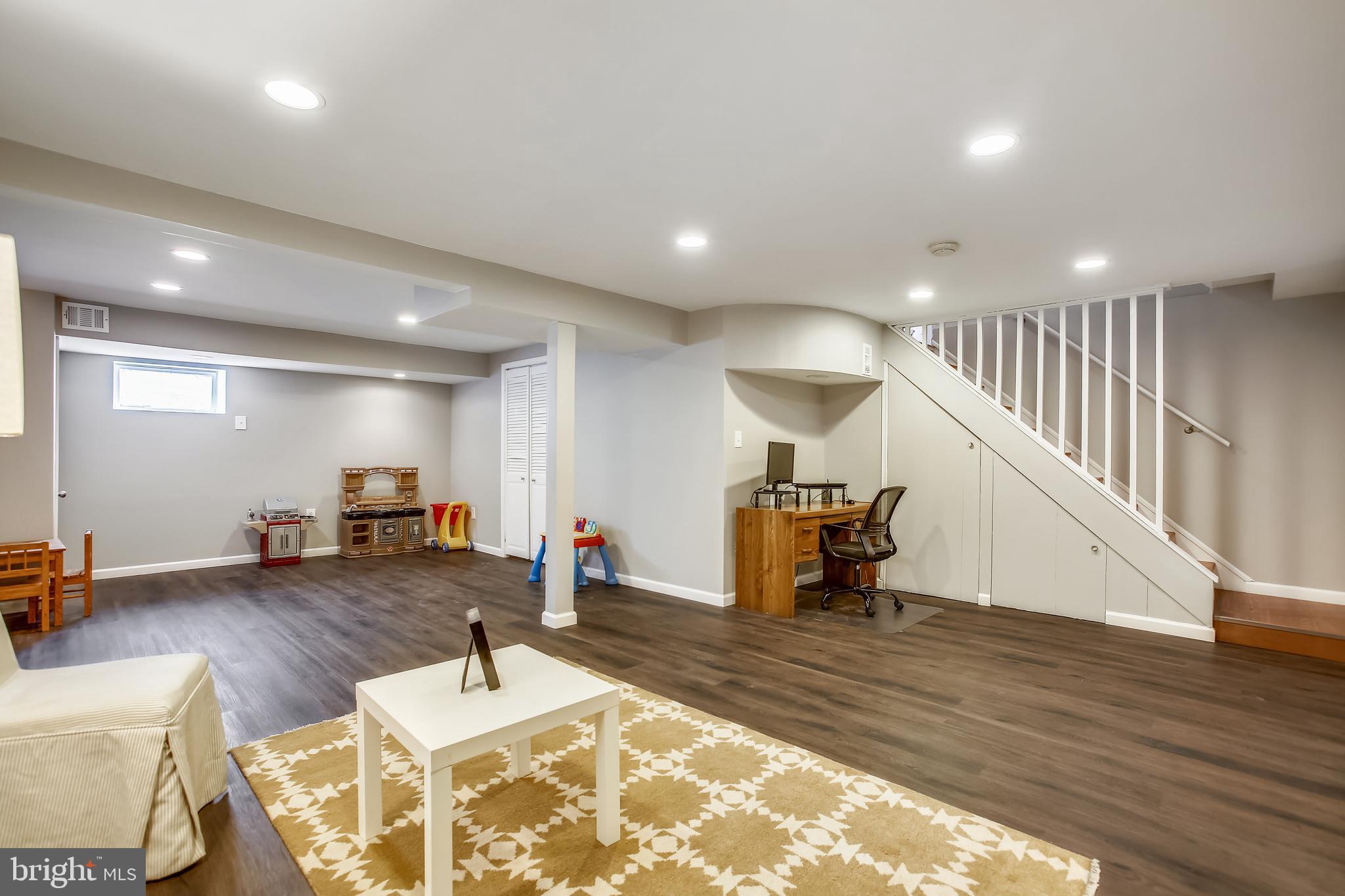6005 Filbert Court Springfield, VA 22152 - Photo 44 of 55 a room with lots of furniture and wooden floors