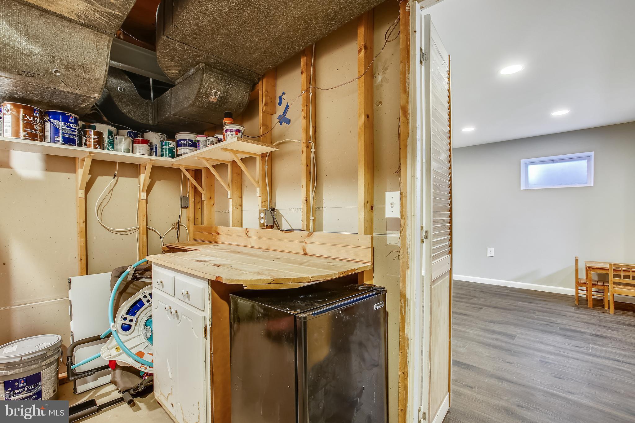 6005 Filbert Court Springfield, VA 22152 - Photo 48 of 55 a utility room with a sink and cabinets
