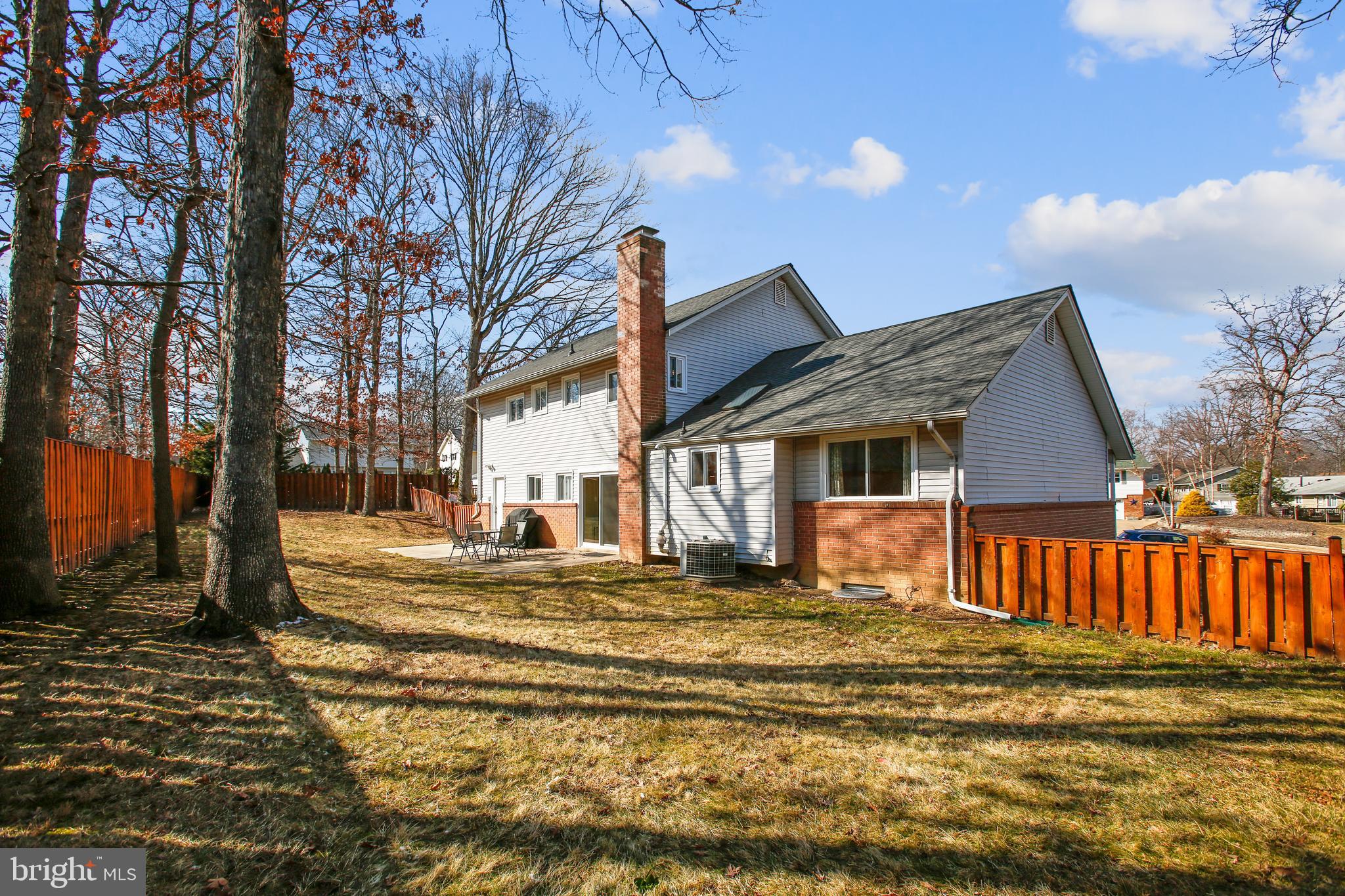 6005 Filbert Court Springfield, VA 22152 - Photo 7 of 55 a front view of a house with a yard