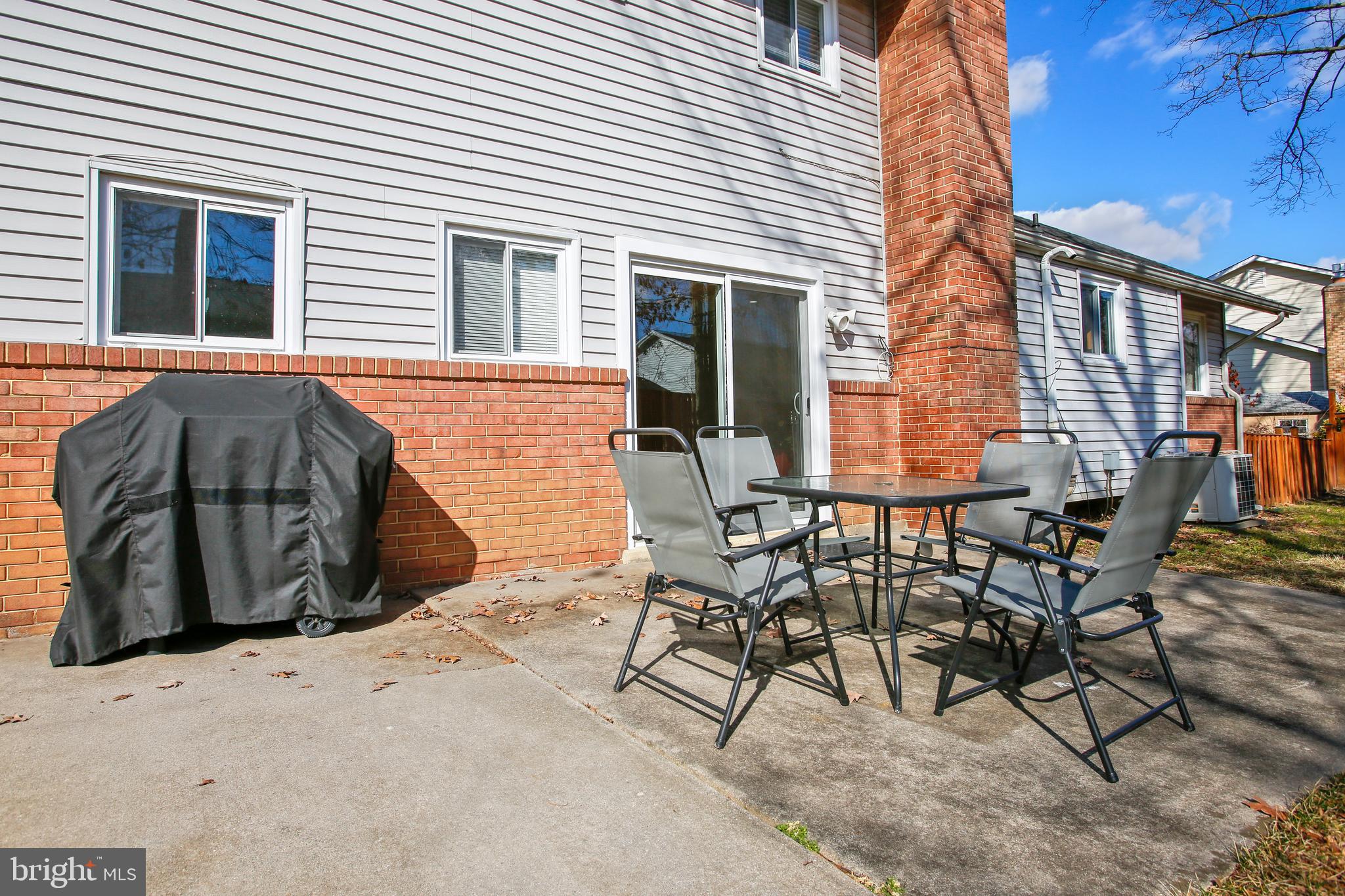 6005 Filbert Court Springfield, VA 22152 - Photo 8 of 55 a view of a patio with table and chairs and wooden floor
