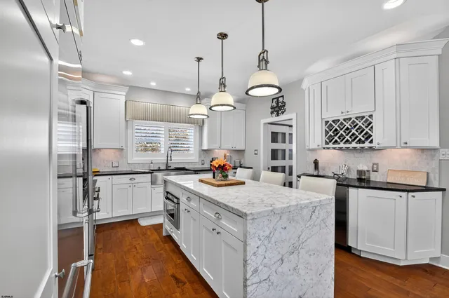 a kitchen with a sink stove and refrigerator
