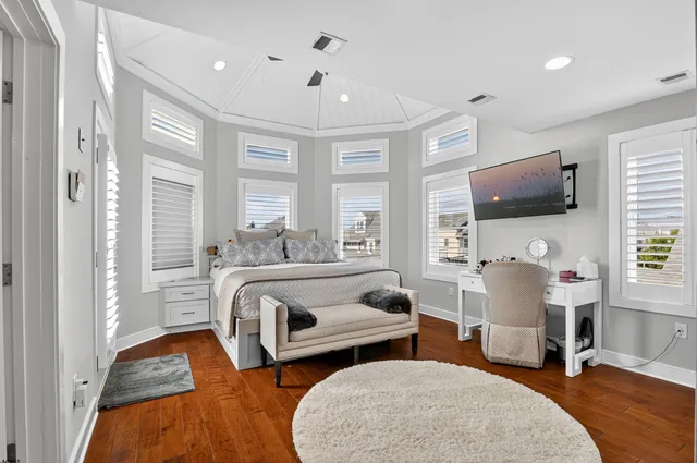 a bedroom with furniture and a window