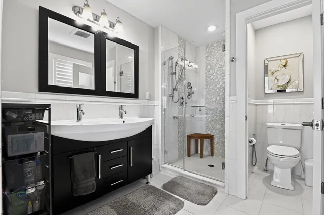 a spacious bedroom with a bed and a window