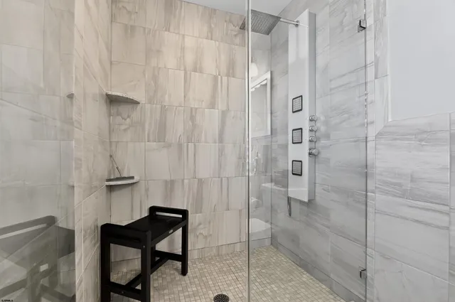 a view of a workspace with furniture and wooden floor