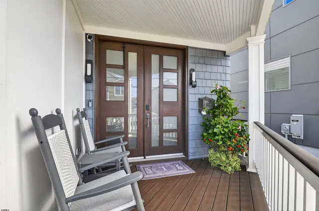 a view of front door with furniture and garden