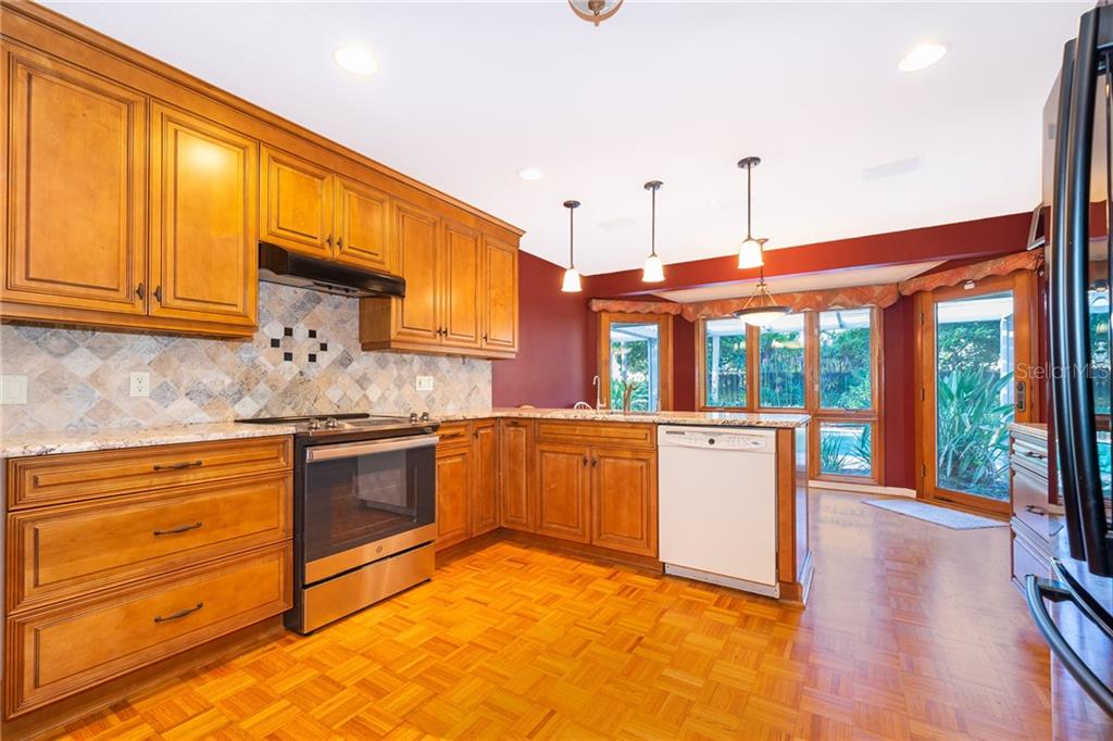 110 Spring Valley Loop Altamonte Springs, FL 32714 - Photo 5 of 47 updated kitchen, granite counters, lovely pool view