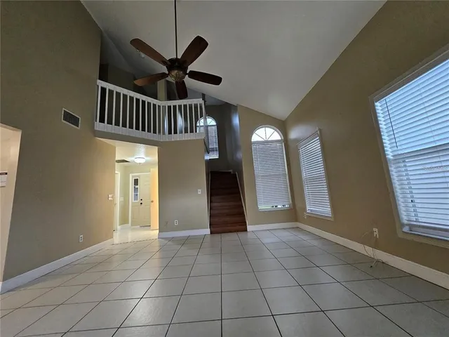 a view of entryway and hall with a front door
