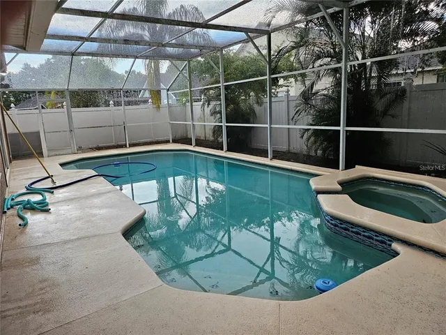 a view of a swimming pool with a patio