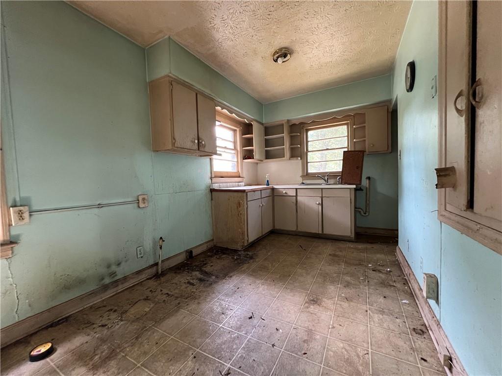 3 Kent Court Columbus, GA 31903 - Photo 5 of 10 a kitchen with stainless steel appliances granite countertop a sink and a refrigerator
