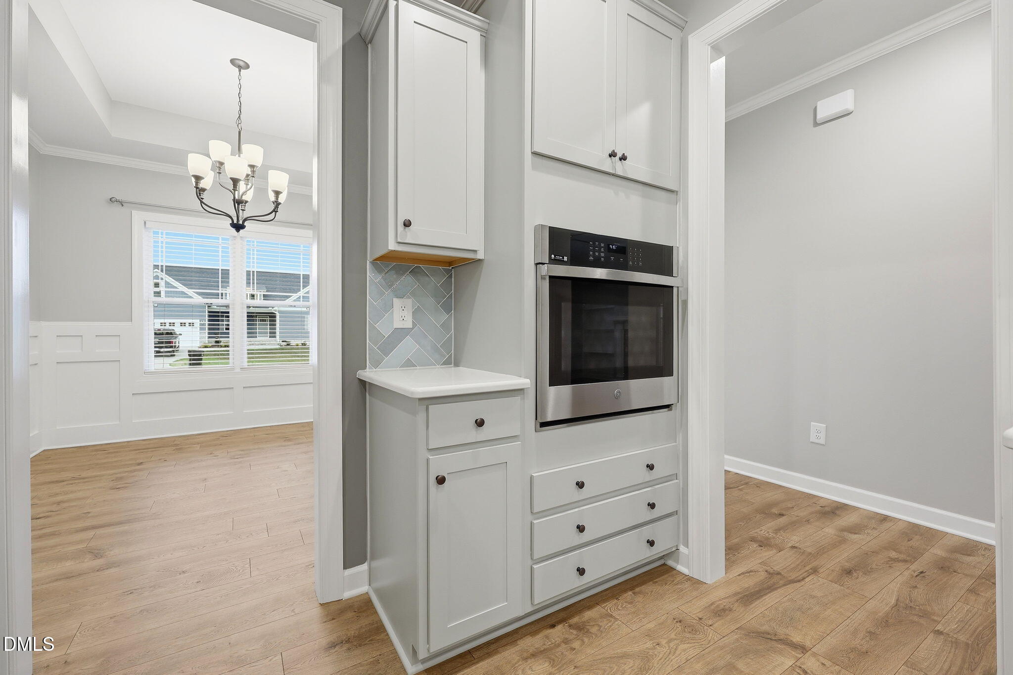 146 Seahawk Way Zebulon, NC 27597 - Photo 19 of 51 a view of cabinets and chandelier