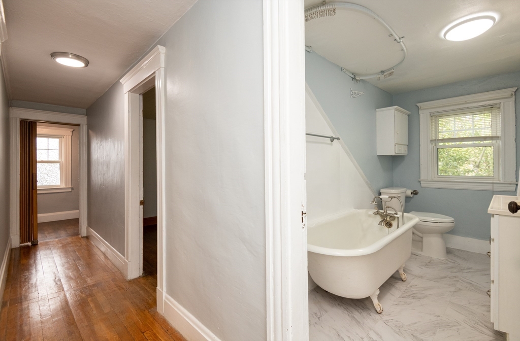 8 Newcomb Avenue Saugus, MA 01906 - Photo 19 of 37 a spacious bathroom with a bathtub and sink