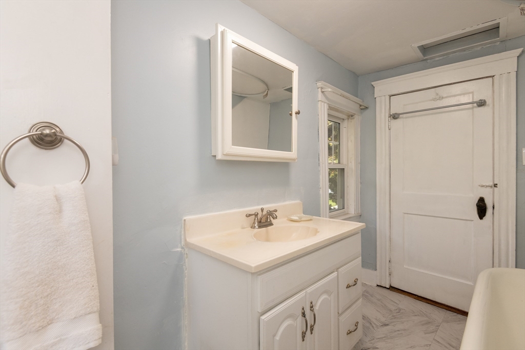 8 Newcomb Avenue Saugus, MA 01906 - Photo 21 of 37 a bathroom with a sink toilet and shower