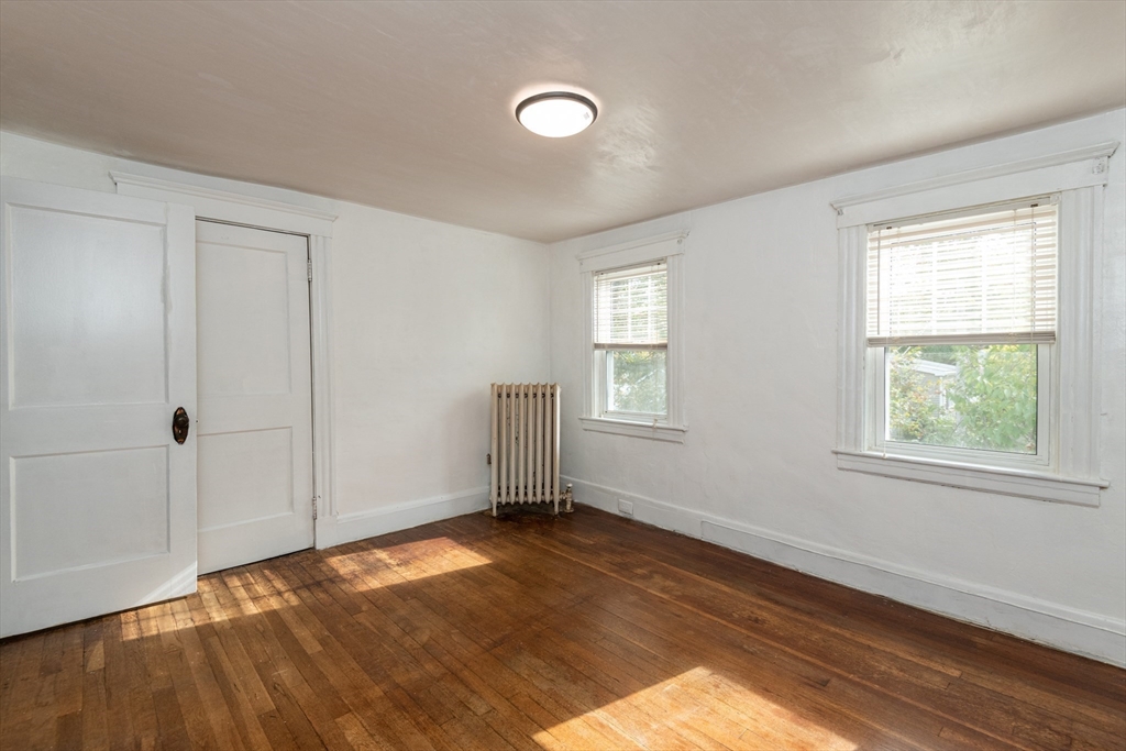8 Newcomb Avenue Saugus, MA 01906 - Photo 24 of 37 a view of an empty room with wooden floor and a window