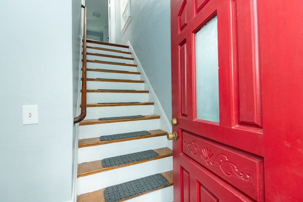 8 Newcomb Avenue Saugus, MA 01906 - Photo 6 of 37 a view of a staircase with wooden walls and a window