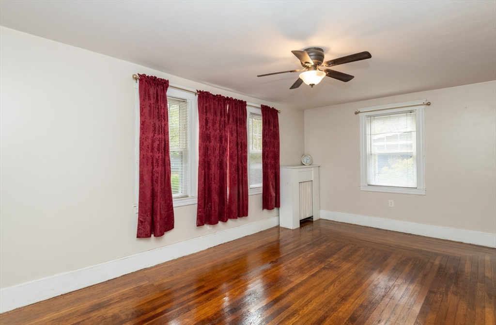 8 Newcomb Avenue Saugus, MA 01906 - Photo 9 of 37 a view of a room with wooden floor and a ceiling fan