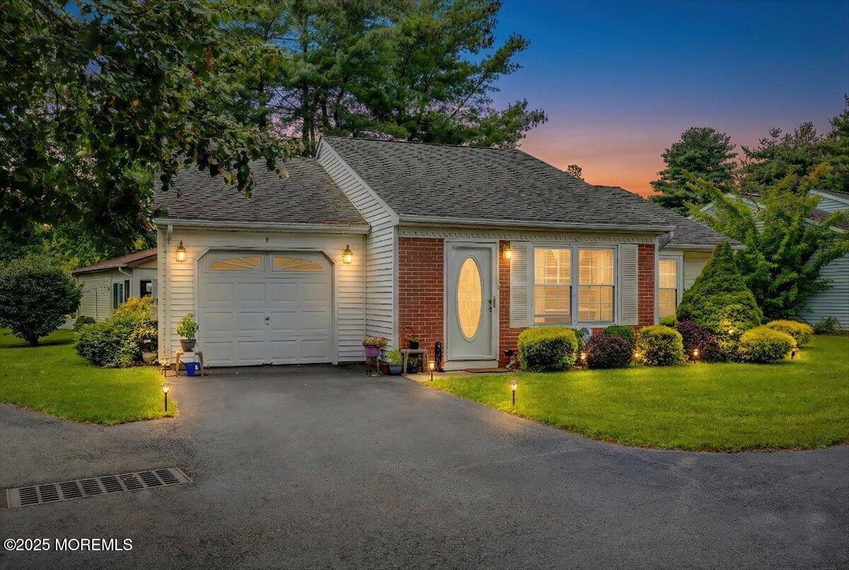 a view of a house with a yard