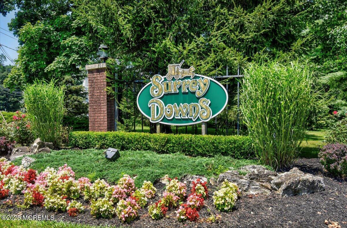 5 Jaffreyton Close Freehold, NJ 07728 - Photo 14 of 39 a sign that is in front of flowers