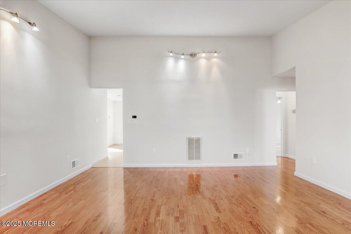 5 Jaffreyton Close Freehold, NJ 07728 - Photo 19 of 39 wooden floor in an empty room