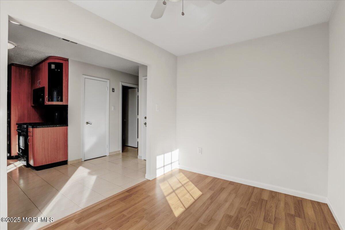 5 Jaffreyton Close Freehold, NJ 07728 - Photo 30 of 39 a view of an empty room and wooden floor