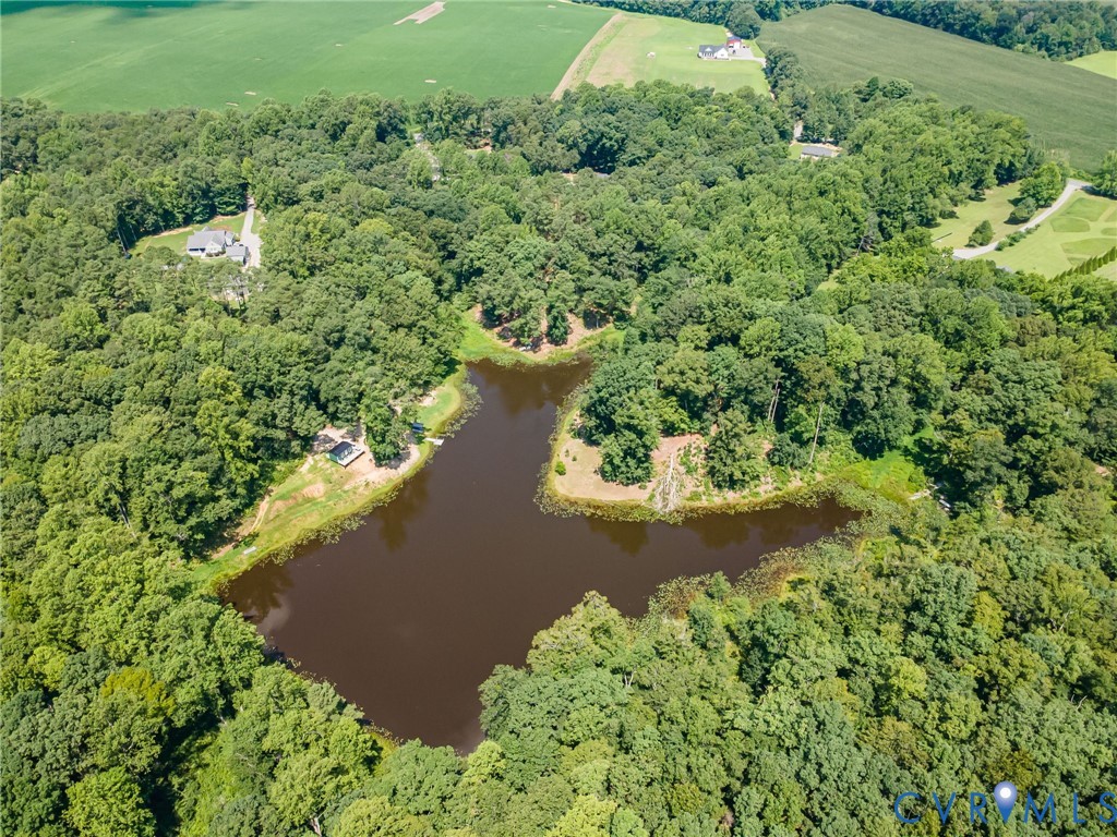 Aerial view of property and surrounding area with