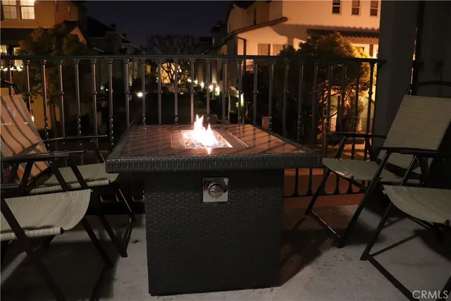 a view of a chairs and table in patio
